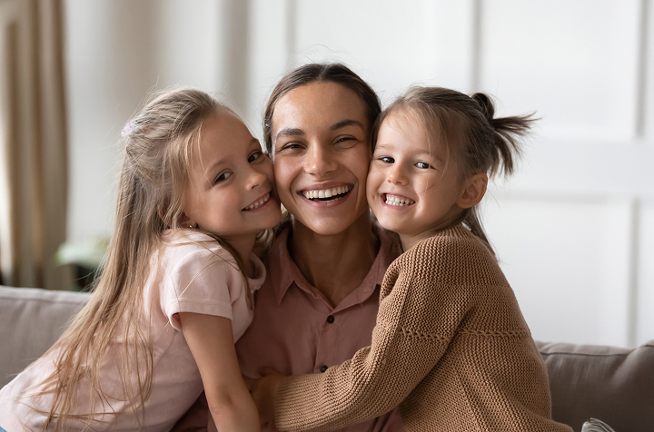 Happy Mother With Two Daughters