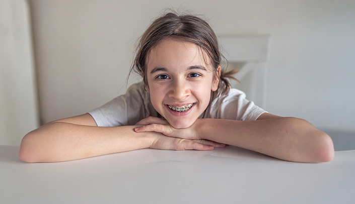 Young Smiling Teen Wearing Braces