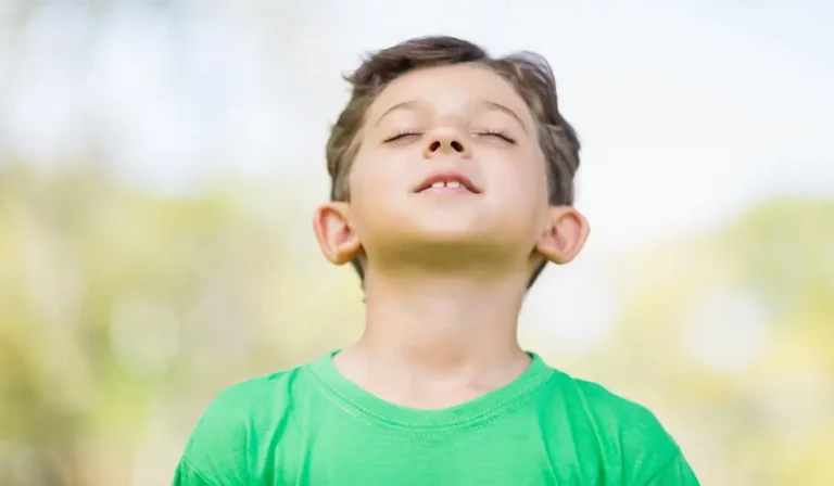Boy In A Field Breathing In With Nostrals Flaired