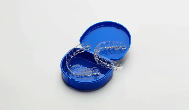 Close Up Of A Plastic Box Showcasing Essix Retainers