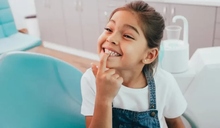Fun Girl Pointing To Her Teeth